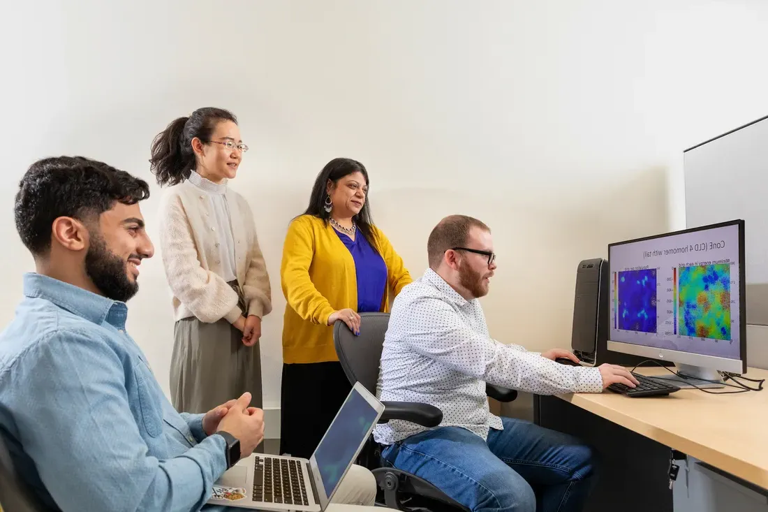 People sitting at a computer.